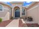 Inviting entryway with double doors, accent windows, and a cozy seating area at 219 Isle Of Sky Cir, Orlando, FL 32828