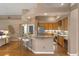 Open kitchen with granite countertops, stainless steel appliances, and breakfast bar at 219 Isle Of Sky Cir, Orlando, FL 32828