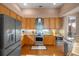 Modern kitchen features stainless steel appliances, granite countertops and ample cabinet space at 219 Isle Of Sky Cir, Orlando, FL 32828