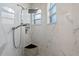 The modern shower features white marble tile, a rainfall shower head, and a convenient corner seat at 219 Isle Of Sky Cir, Orlando, FL 32828