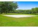 A well-maintained volleyball court surrounded by green grass, offering an ideal space for outdoor fun and exercise at 219 Isle Of Sky Cir, Orlando, FL 32828