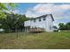 Spacious backyard with a deck, fencing, and attractive landscaping at 2304 Harding Cir, Deltona, FL 32738