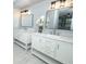 Elegant bathroom with double vanity, marble countertops, and modern lighting at 2304 Harding Cir, Deltona, FL 32738