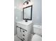 This bathroom features a vanity with modern fixtures and a white toilet at 2304 Harding Cir, Deltona, FL 32738