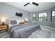Bright bedroom with bay windows, ceiling fan, and stylish decor at 2304 Harding Cir, Deltona, FL 32738