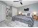 Bedroom showcasing ensuite bath, white closet doors, and modern gray decor at 2304 Harding Cir, Deltona, FL 32738