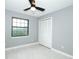 Cozy bedroom with gray walls, closet, and natural light from window at 2304 Harding Cir, Deltona, FL 32738
