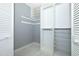 Open closet space with wire shelving and white cabinets at 2304 Harding Cir, Deltona, FL 32738