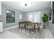This dining area features modern decor, a wooden table set, and ample natural light at 2304 Harding Cir, Deltona, FL 32738