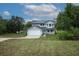 Attractive two-story home with a two-car garage and well-maintained lawn at 2304 Harding Cir, Deltona, FL 32738