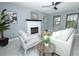 Bright living room with white brick fireplace and contemporary decor at 2304 Harding Cir, Deltona, FL 32738