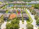 Great aerial view of the home in a Gathering-friendly neighborhood with a community lake and mature trees at 2515 Dharma Cir, Kissimmee, FL 34746