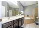 Bathroom features a large vanity, soaking tub, and separate shower stall at 2515 Dharma Cir, Kissimmee, FL 34746