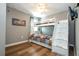This cozy bedroom features hardwood floors, a ceiling fan, and a white bunk bed with pull out drawers for additional storage at 2515 Dharma Cir, Kissimmee, FL 34746