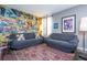 Upstairs bonus room area with comic book wallpaper and cozy furniture provides a space for relaxing at 2515 Dharma Cir, Kissimmee, FL 34746
