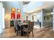 Dining room with natural light, high ceilings, modern chandelier, and seating for eight at 2515 Dharma Cir, Kissimmee, FL 34746