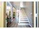 Bright and airy foyer with hardwood floors and a staircase, creating a welcoming entrance to the home at 2515 Dharma Cir, Kissimmee, FL 34746