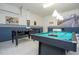 Garage rec room features a foosball table and pool table at 2515 Dharma Cir, Kissimmee, FL 34746