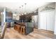 Well-equipped kitchen with dark cabinets, granite counters, and a breakfast bar at 2515 Dharma Cir, Kissimmee, FL 34746