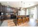 Modern kitchen with dark cabinets, granite countertops, and stainless steel appliances at 2515 Dharma Cir, Kissimmee, FL 34746