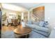 Open-concept living room and dining area with wood floors and comfortable seating at 2515 Dharma Cir, Kissimmee, FL 34746