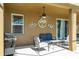 Covered patio with ceiling fan, outdoor furniture and grill at 2515 Dharma Cir, Kissimmee, FL 34746