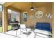 Covered patio with ceiling fan, outdoor furniture and black grill at 2515 Dharma Cir, Kissimmee, FL 34746