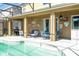 Covered patio with outdoor grill, patio furniture and access to the swimming pool at 2515 Dharma Cir, Kissimmee, FL 34746