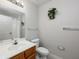 Bathroom with vanity, mirror, and standard white toilet at 2605 Gala S Rd # 106, Kissimmee, FL 34746