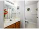 Bathroom featuring a white vanity with wood drawers, a mirror, and a toilet at 2605 Gala S Rd # 106, Kissimmee, FL 34746
