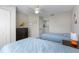 Bedroom with twin beds, closet, and dark wood dresser at 2605 Gala S Rd # 106, Kissimmee, FL 34746