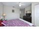 Bedroom featuring carpet, artwork, ceiling fan and dresser at 2605 Gala S Rd # 106, Kissimmee, FL 34746