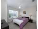 Well-lit bedroom with large windows, carpet, and a ceiling fan at 2605 Gala S Rd # 106, Kissimmee, FL 34746