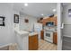Well-maintained kitchen boasting essential appliances, warm wood cabinetry, and tile flooring at 2605 Gala S Rd # 106, Kissimmee, FL 34746