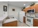 Functional kitchen featuring white appliances, tile flooring, and ample cabinet storage space at 2605 Gala S Rd # 106, Kissimmee, FL 34746