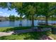Community lake with gazebo, picnic tables, fountain and barbecue at 2605 Gala S Rd # 106, Kissimmee, FL 34746