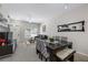 Cozy living room and dining area featuring neutral colors, comfortable seating, and natural light at 2605 Gala S Rd # 106, Kissimmee, FL 34746