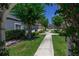 Charming street view with sidewalks, landscaping and colorful homes at 2605 Gala S Rd # 106, Kissimmee, FL 34746