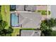 Aerial view showcasing a private backyard pool and well-maintained roof, with a charming neighborhood layout at 2621 Peony Dr, Oviedo, FL 32766