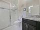 This bathroom features a glass-enclosed shower, granite counters, and stylish fixtures at 2621 Peony Dr, Oviedo, FL 32766