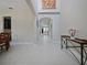 Bright foyer with neutral-toned walls, tile flooring, and archway leading to the living area at 2621 Peony Dr, Oviedo, FL 32766