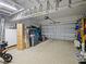 Garage showcasing ample storage space, shelving units, and an electric door opener for easy access and organization at 2621 Peony Dr, Oviedo, FL 32766