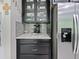 Kitchen featuring a stainless steel refrigerator and coffee bar at 2621 Peony Dr, Oviedo, FL 32766