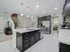 Spacious kitchen with island, stainless steel appliances, and ample counter space at 2621 Peony Dr, Oviedo, FL 32766