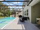 This screened-in pool features a spacious patio and comfortable seating, ideal for enjoying the outdoors at 2621 Peony Dr, Oviedo, FL 32766