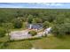 An elevated perspective of the home set amongst lush trees at 2630 S Tanner Rd, Orlando, FL 32820