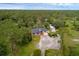 An elevated perspective of the home set amongst lush trees at 2630 S Tanner Rd, Orlando, FL 32820