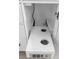 Modern bathroom features pull-out shelving with power outlets beneath the vanity at 2630 S Tanner Rd, Orlando, FL 32820