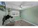 A cozy bedroom features a hanging chair, tile floors, and modern decor at 2630 S Tanner Rd, Orlando, FL 32820