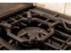 Close-up of a gas cooktop burner with ornate rack at 2630 S Tanner Rd, Orlando, FL 32820